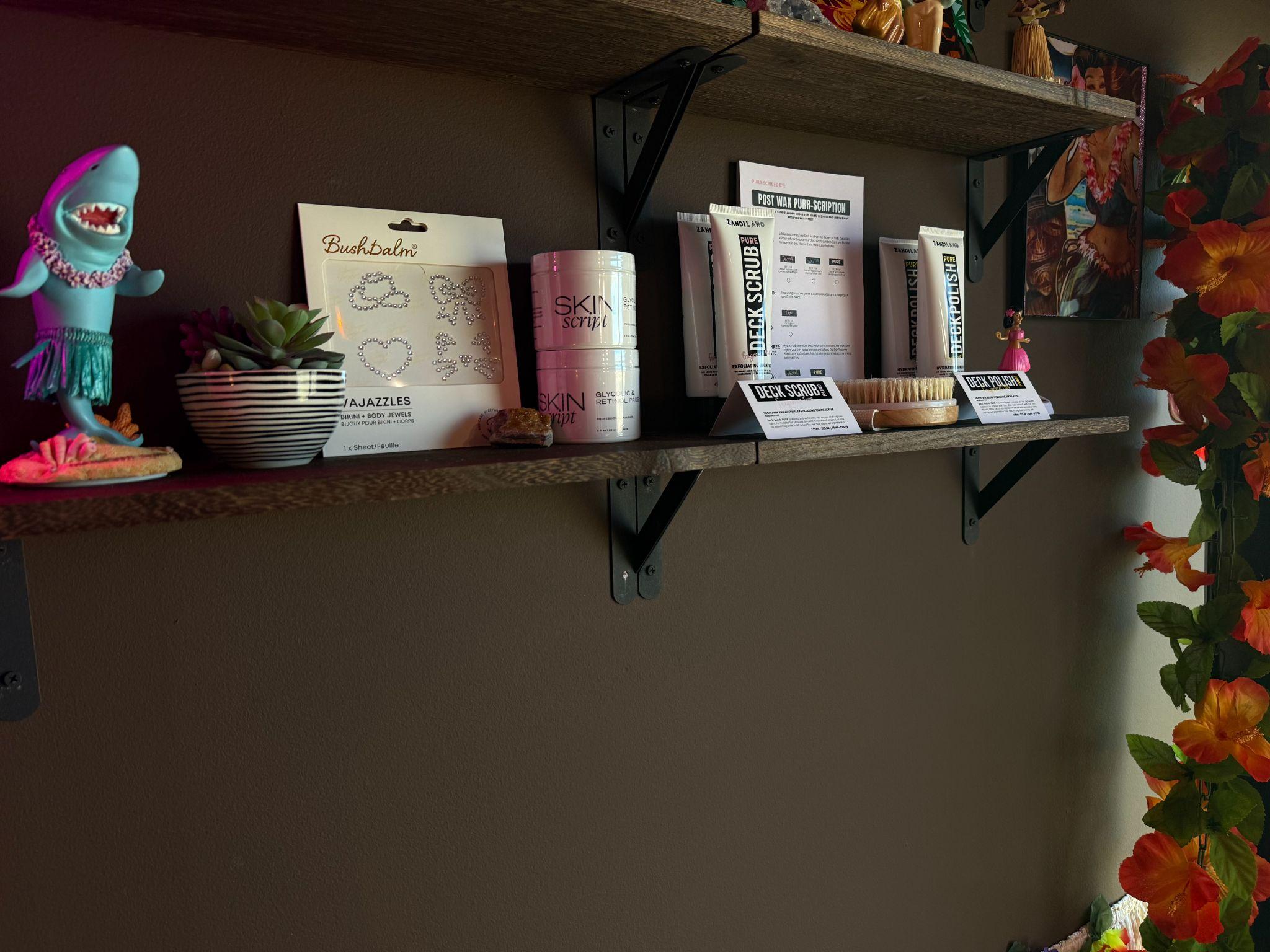 Retail shelf with aftercare products at the Bare Hibiscus studio