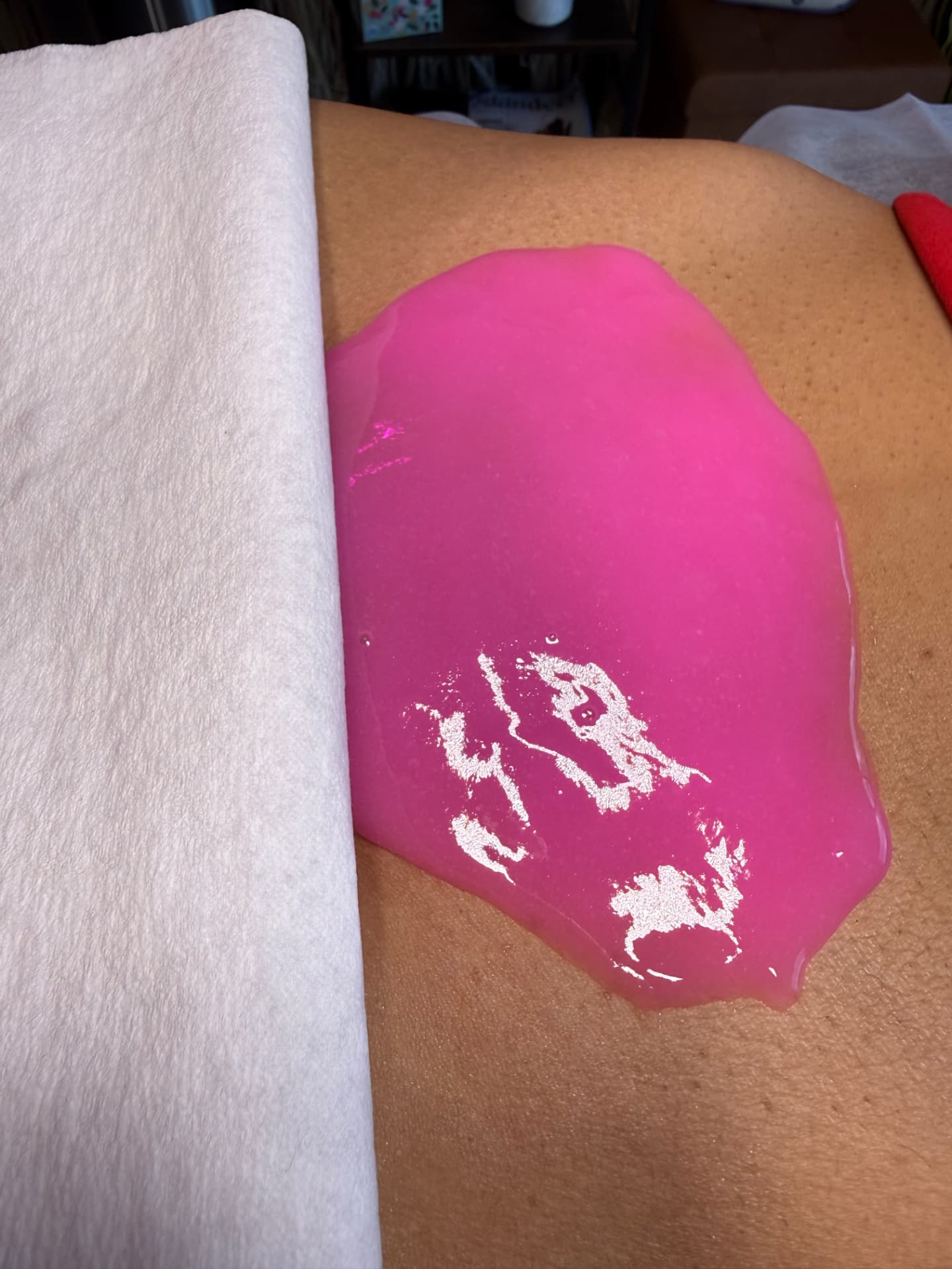Pink hydrojelly mask applied to skin during a treatment